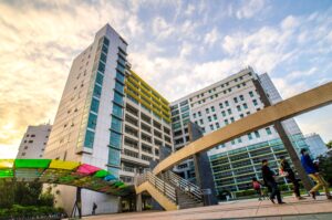 Taiwan Tech Campus; tall buildings with students in the foreground.